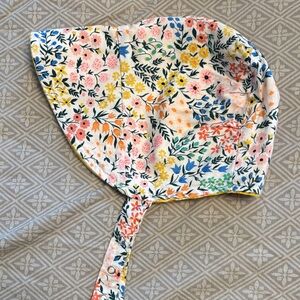Urban baby bonnet reversible sun bonnet in sunshine flowers.